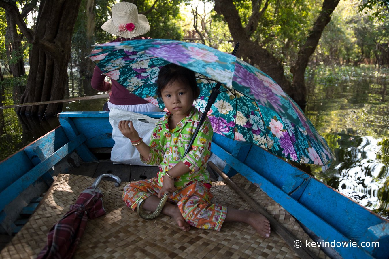 Young girl under umbrella